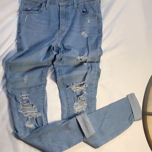 Levi’s high rise super skinny blue jeans. Size W26 L32